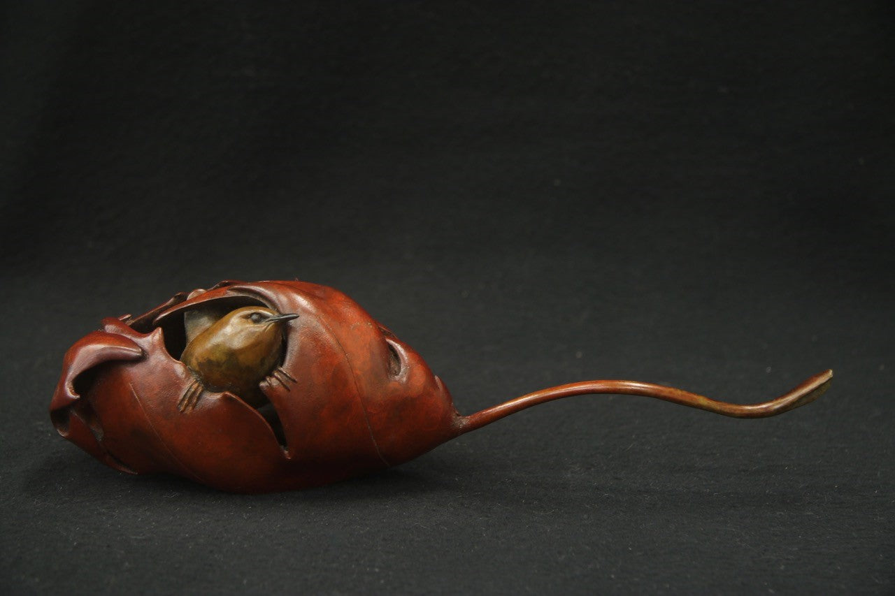 Bronze sculpture wren in maple leaf