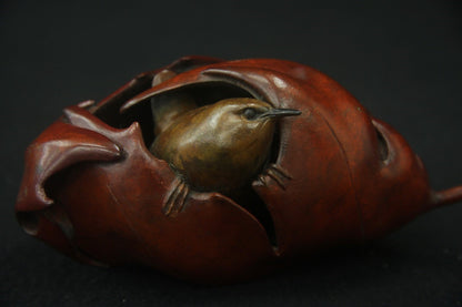 Bronze sculpture wren in maple leaf Adam Binder